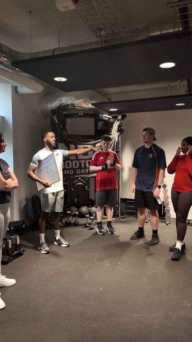 Coach and NDO members in the gym